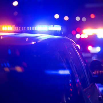 Murder suspect bails off overpass in front of semi truck