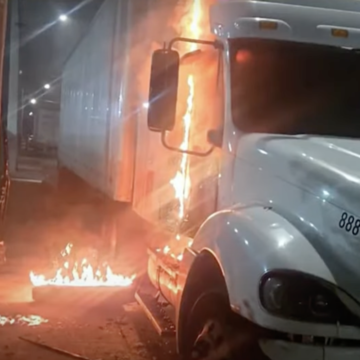 Sleeping driver escapes flaming truck in possible arson