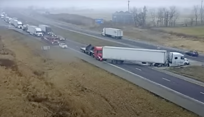 Fellow trucker helps out when big rig gets stuck during U-turn attempt