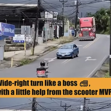 Watch a scooter driver have the foresight to help a trucker out