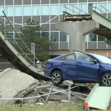 Truck decimates pedestrian bridge and innocent sedan