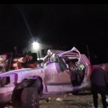 Pickup slams into back of parked log truck, killing two