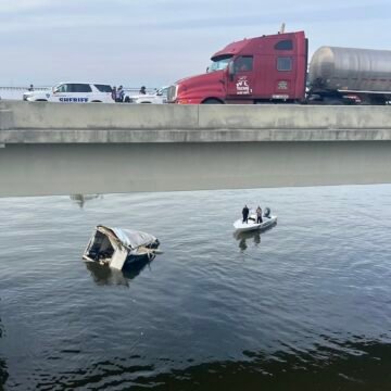 Trucker pulled from water alive after semi truck plummets off Twin Span Bridge