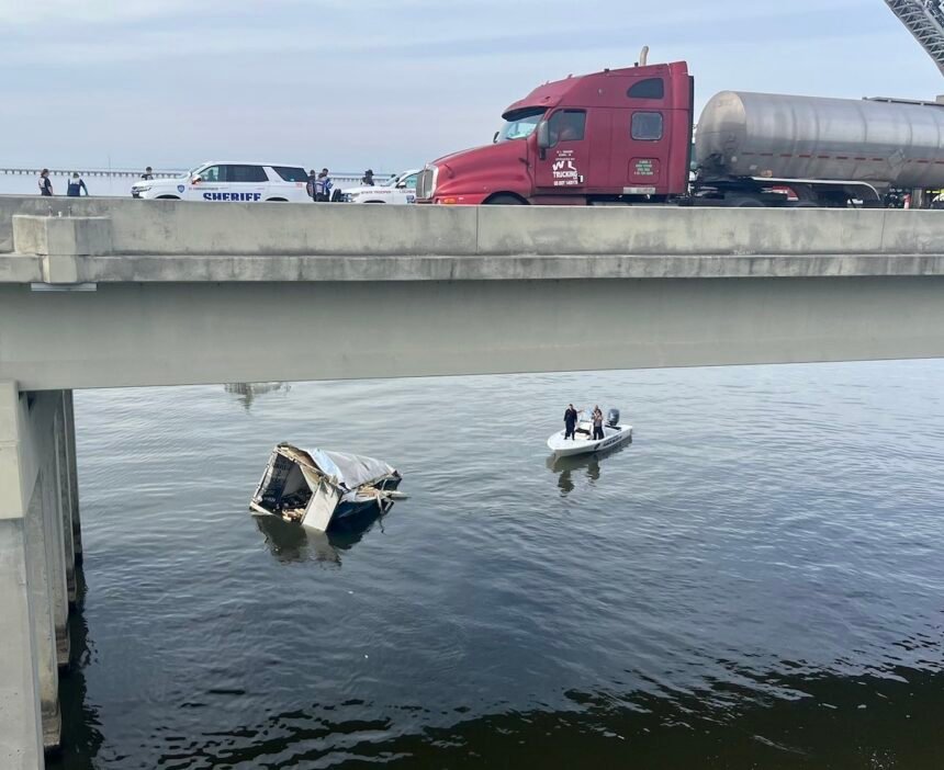 Trucker pulled from water alive after semi truck plummets off Twin Span Bridge