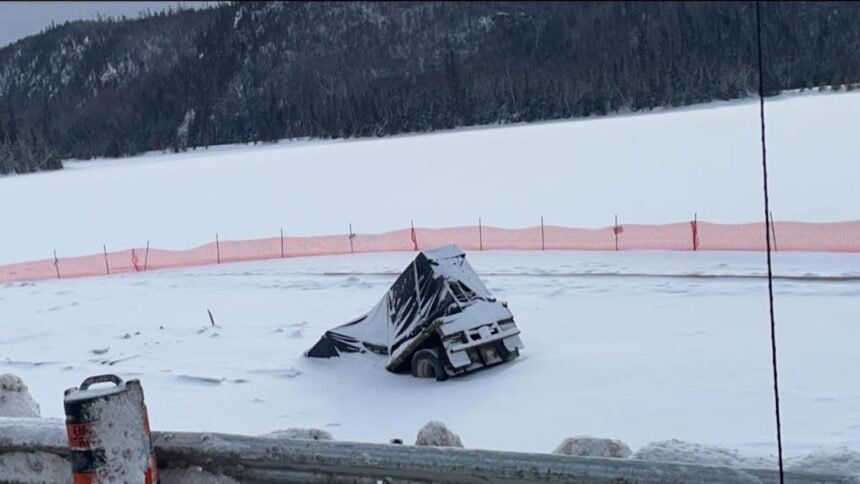 Semi truck that crashed through frozen lake moments after driver escaped cab still sitting there