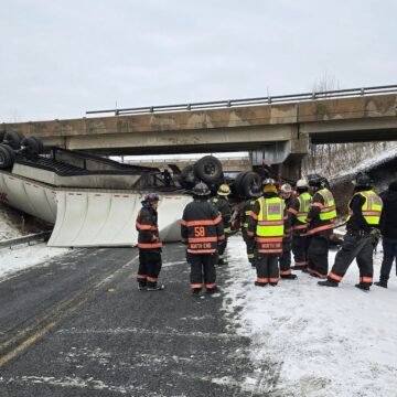 Driver walks away from smushed tractor trailer after running off I-81 bridge