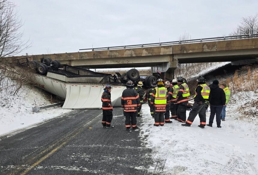 Driver walks away from smushed tractor trailer after running off I-81 bridge