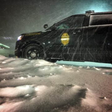 Man fatally struck while assisting semi truck driver in snowy gas station lot