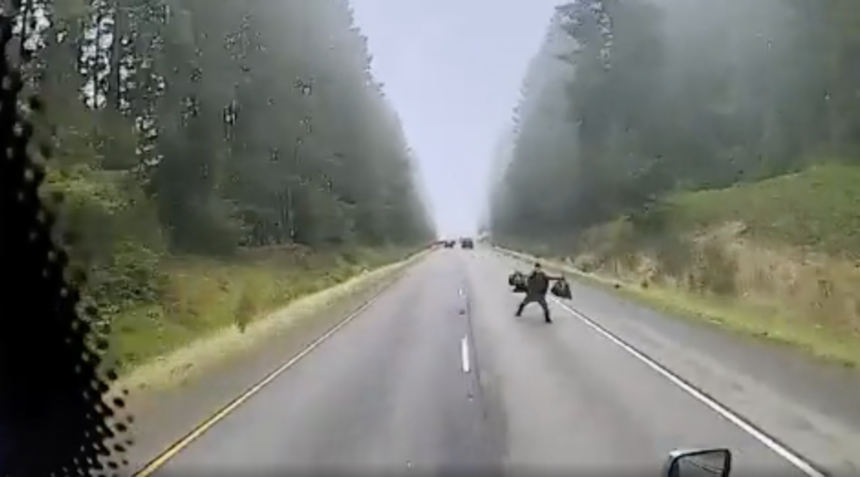 Screen-Shot-2025-01-02-at-10.18.43-AM.png Dash cam shows trucker forced to swerve after man holding bags leaps into his lane