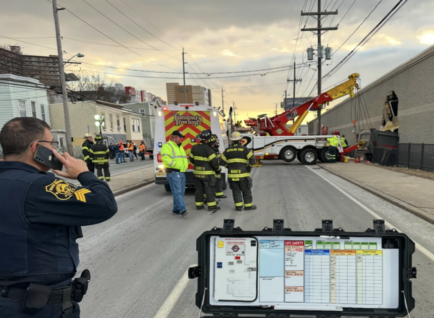 Six hurt after dump truck hits tractor trailer, plows into Target store