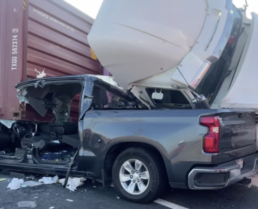 Two trapped when semi truck lands on top of pickup on the 710 Freeway