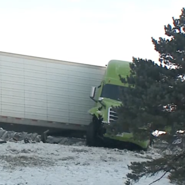 Driver says he looked down for his drink moments before pushing Prius off overpass