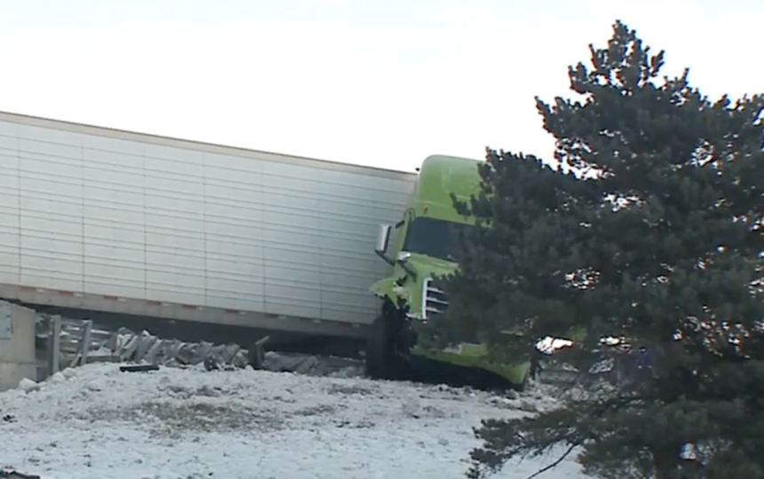 Driver says he looked down for his drink moments before pushing Prius off overpass