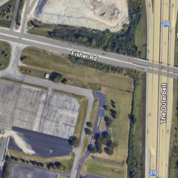 Trucker struck by two cars after stopping in left turn lane outside of warehouse