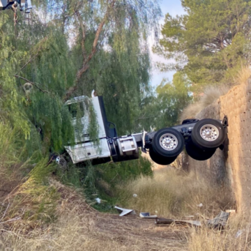 CHP scolds truck driver for ‘incredible parking job’ that left big rig wedged in ditch