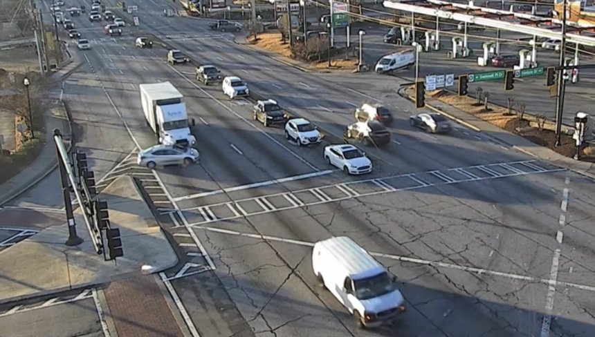 Video shows truck pushing car through two intersections, resulting in charges for truck driver, Georgia cops say