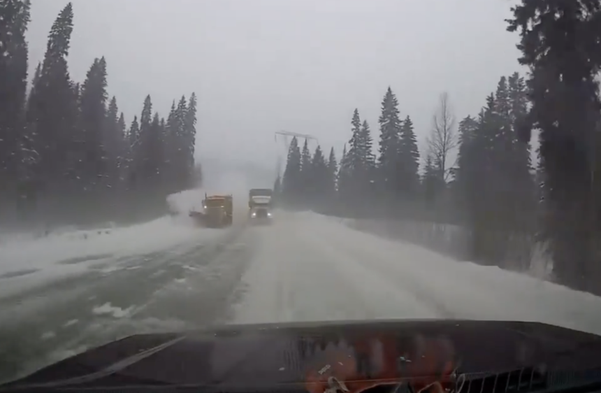 Trucker passing snow plow on a curve almost obliterates motorist