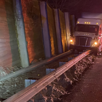 Truck driver arrested for DUI after taking out several hundred feet of guardrail