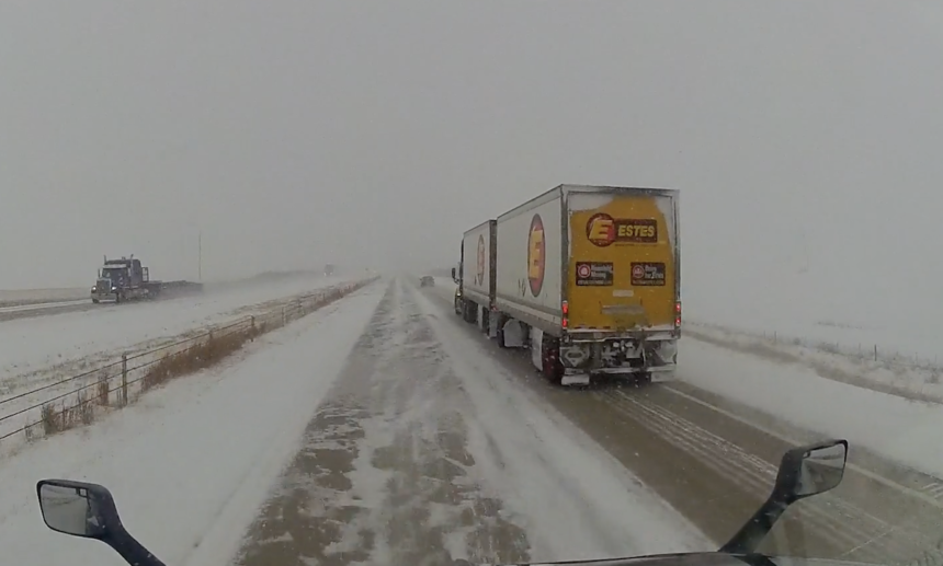 Fast-driving trucker accidentally saves driver hauling doubles from an icy jackknife
