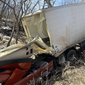 Driver rescued from smashed cab after driving into creek near rest stop 