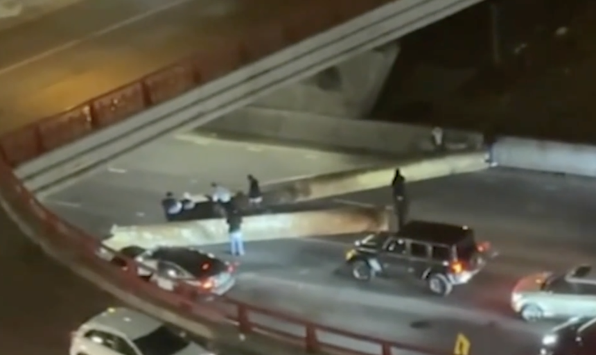Two injured when large steel pipes roll off flatbed driving through Chicago